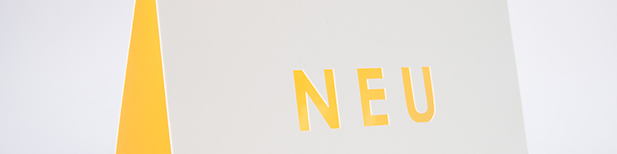 Klappkarte mit Laserstanzung „Neu”